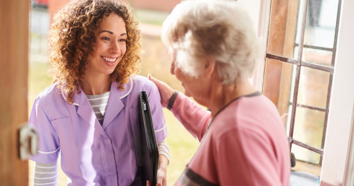 A caregiver enters a senior’s home to provide respite care services.