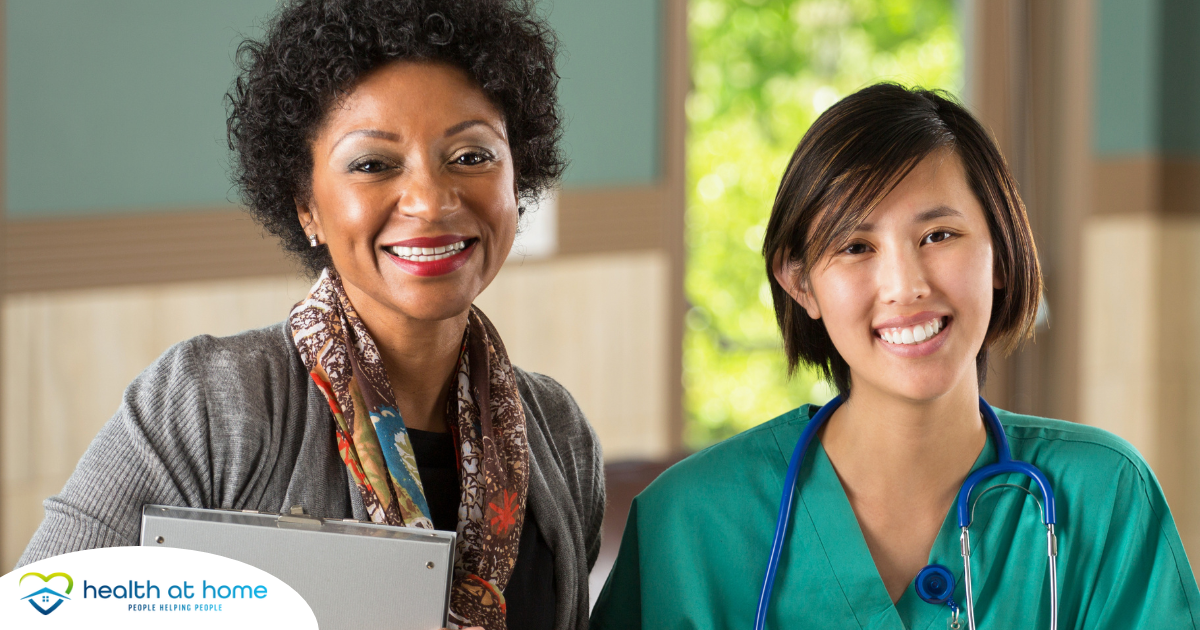 Two different healthcare professionals smile, representing the joy that can come from working with others in the home health environment.