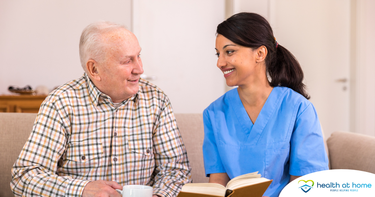 A professional caregiver enjoys her flexible career as she cares for and reads to an older client.